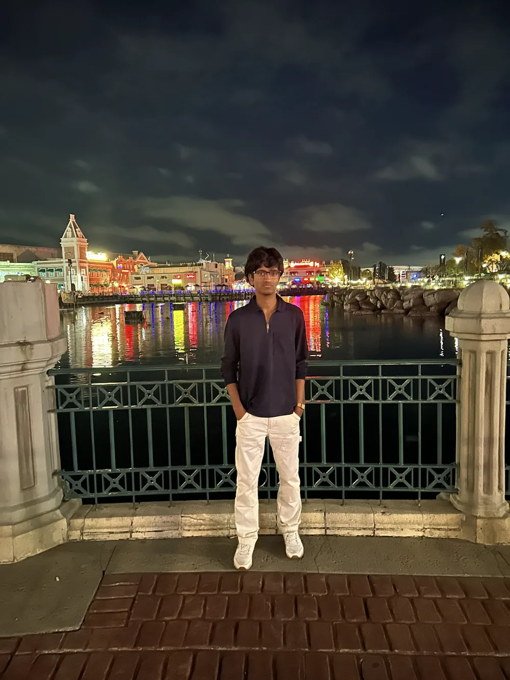 Parth Joshi standing beside the water at night